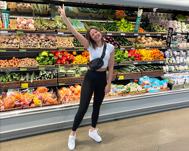 Michelle shopping for fresh produce at the grocery store