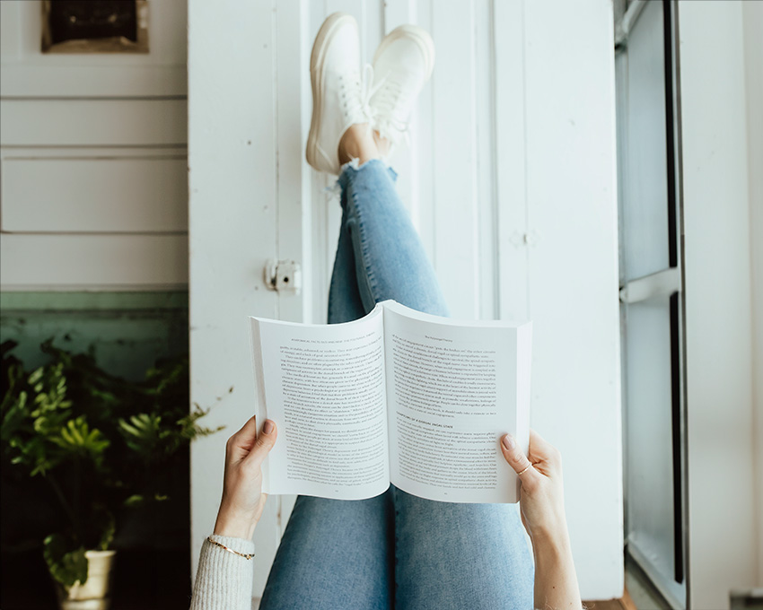 Relaxing with a book, feet up