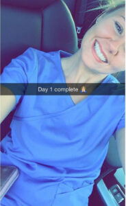 a woman smiling taking a selfie